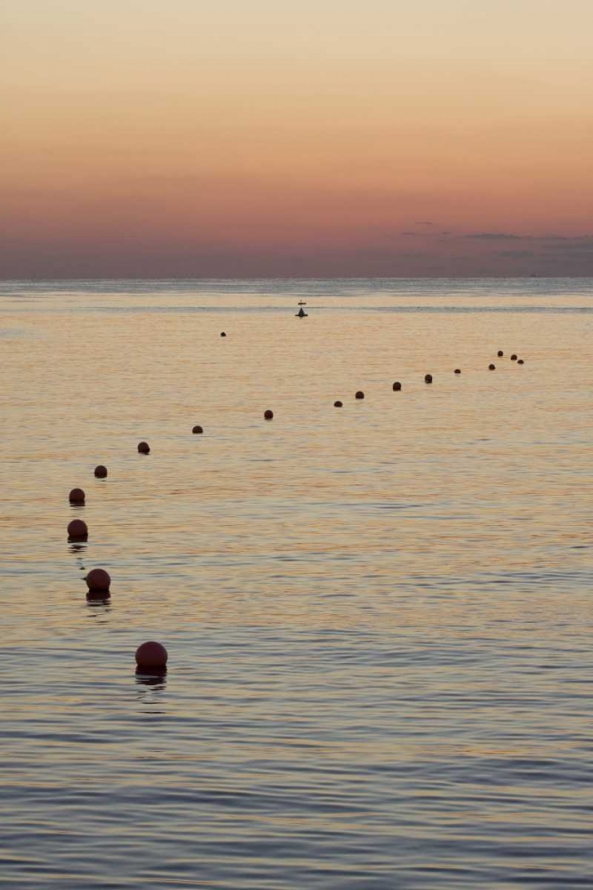 Art Print: UAE, Fujairah Sunrise over marker buoys on beach