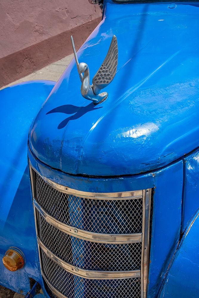 Wall Art Painting id:399441, Name: Detail of classic blue American car with chrome swan hood ornament in Trinidad-Cuba, Artist: Miglavs, Janis