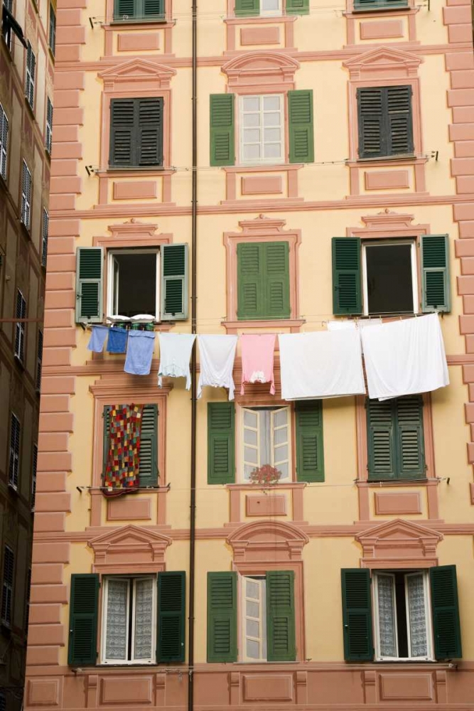 Art Print: Italy, Camogli Laundry hangs across a building