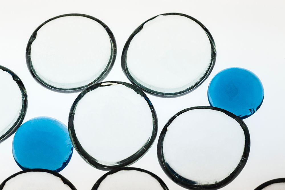 Art Print: White and Blue glass pebbles with light