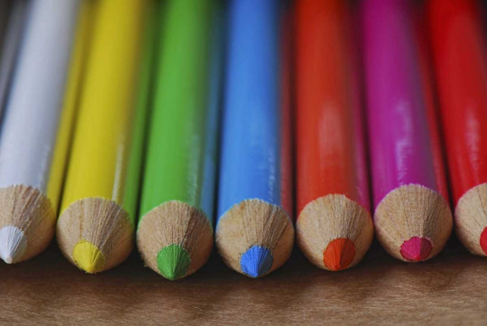 Art Print: Row of multicolored colored pencils lay on table